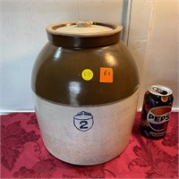 Old brown and white crock with lid