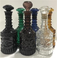 Set of colored antique liquor bottles