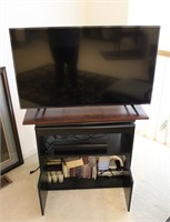 44" Hisense TV w/ Cabinet of DVDs,CDs & DVD Player