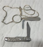 Silver colored knife and other