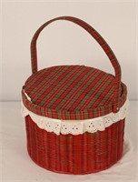 TWO WICKER SEWING BASKETS WITH MATERIAL INSIDE
