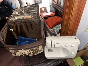 Brother sewing machine with rolling case & supply