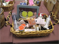 1 basket of bath & body items: candles, lotion,