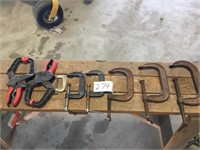 6 assorted sized C clamps and 2 wood clamps