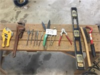 Assorted spade bits, pipe wrench, level, and other