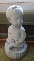 Concrete baby figurine