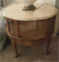 Round marble top table with open shelf