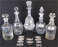Five Glass Decanters with Badges