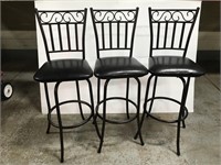 Three swivel bar stools