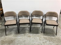Set of four padded folding chairs