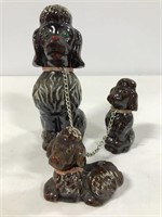 Ceramic leashed poodle dog trio