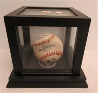 Autographed Pete Rose baseball with display case.