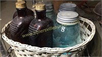Basket of bottles and fruit jars