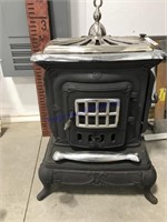 Cast iron wood  stove w/chrome trim