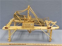 Handmade replica of a fish wheel, has "Emmet Cotes