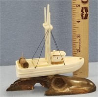Ivory carving of a fishing vessel by Michael Scott