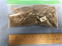 Bag of St. Lawrence Island artifacts, include bone