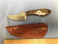 3" Damascus bladed skinning knife with a wood hand