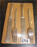 Two sets of Knives & Forks from Thoma & Sons.