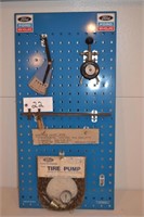 Ford tool board with mower tools and tire pump