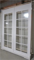 New French double door with glass panes and jamb.
