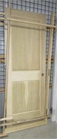 New unfinished wood interior door with jamb. Jamb