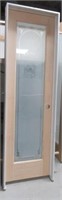 Wood pantry door with glass panel and jamb. Jamb