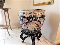 Large Chinese decorative pot with black stand