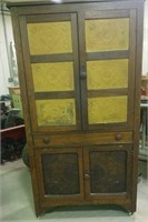 Cabinet with tin punched top doors