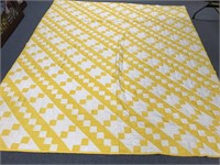 Yellow and white checkered quilt