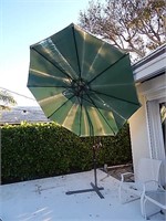 Outdoor tilting umbrella