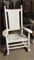 Antique porch rocker with wicker seat and back