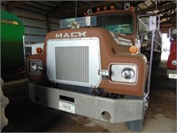 1974 Mack semi-tractor, showing 471,068 miles;