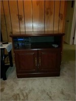 Wood movie cabinet with VHS and DVD's