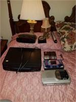 Estate lot of radios, lamps, VHS player, clocks