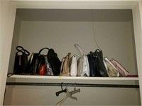 Closet of purses, racks, and comforter set