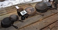 Large lot of cast iron pans and more. Includes