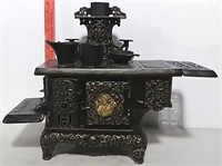 The Queen cast iron toy stove