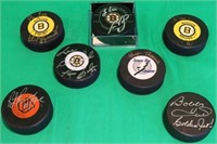 LOT OF 7 SIGNED HOCKEY PUCKS TO INCLUDE BRUIN'S