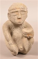 Costa Rican Stone Sculpture of a Seated Man Holdin