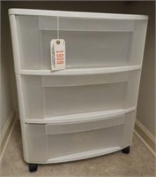 Plastic three drawer storage chest on castors