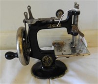 Antique child’s toy Singer Sewing machine