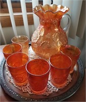 Carnival Glass pitcher and glasses