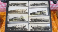 8 assorted train photographs