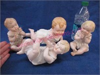 4 vintage porcelain "piano babies"