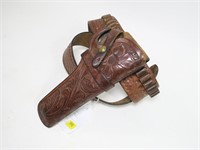 Tooled leather holster and cartridge belt