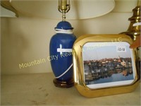 Blue lamp and brass picture frame