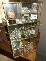 Brass and glass case with crystal figurines