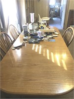 8’ oak dining room table (2 leafs) and 6 chairs