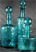 SET OF THREE BLUE ART GLASS DECANTERS